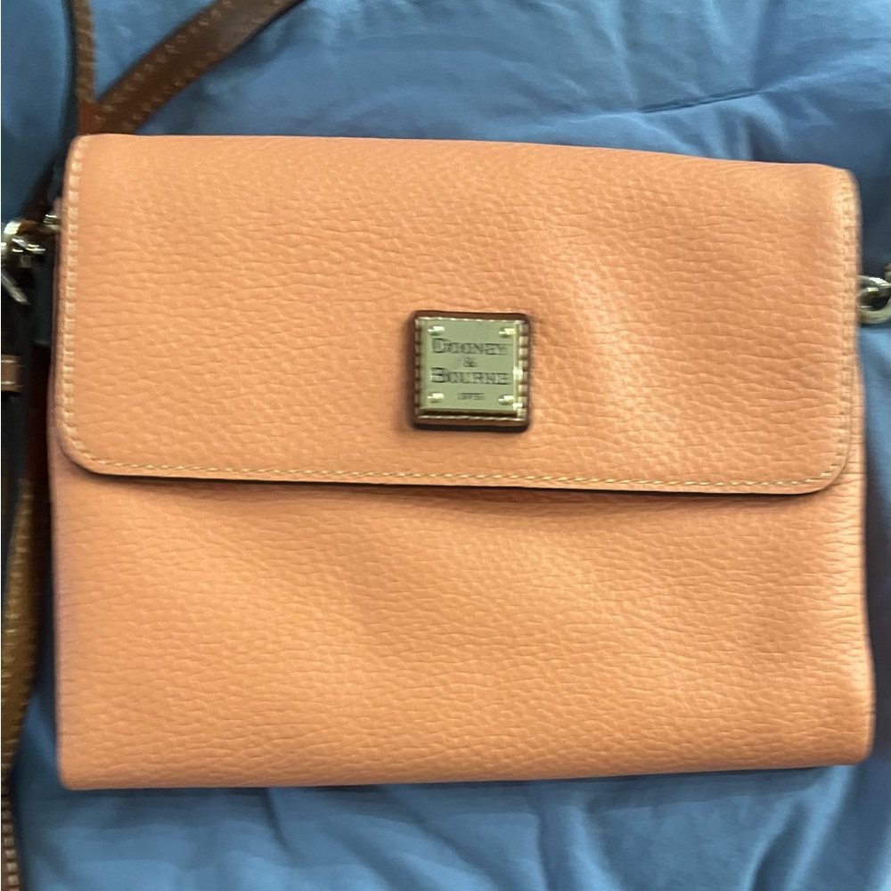 DOONEY & BOURKE purse, orange with outside pocket and 2 zipper inside pockets.